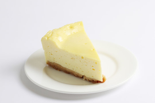 Slice of cheesecake on the white plate