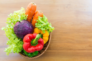 Healthy vegetable in basket put on wooden table