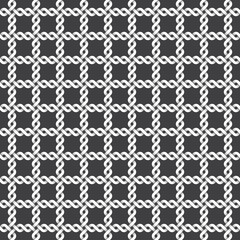 Abstract repeatable pattern background of white twisted strips. Swatch of intertwined twines.