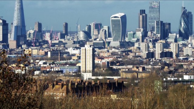 Aerial tilt up view of the skyline of the City of London