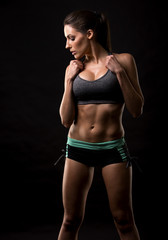 Fototapeta na wymiar fitness woman on black background