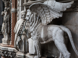 Particular of Doge's Palace Facade in Venice: Marble Winged Lion