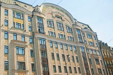 Fototapeta premium Building façades with stucco molding and bars balconies. Moscow, Russia. 