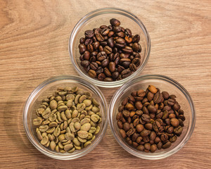 Three types of coffee in glass shelves placed in a triangle on a