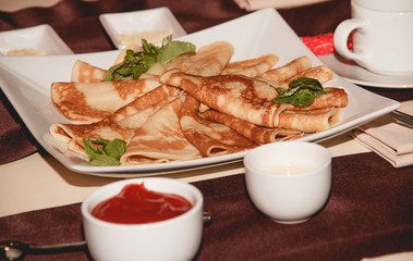 Fresh homemade crepes on plate
