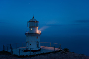 Fototapeta na wymiar lighthouse above the sea