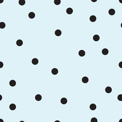 Vector seamless pattern with small black polka dots on the soft blue background. 