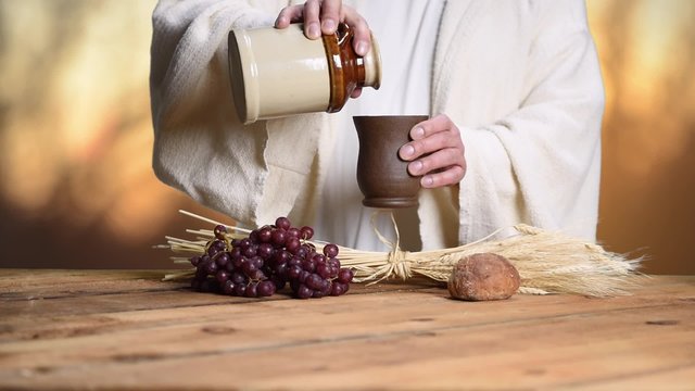 Jesus sharing elements at Communion table