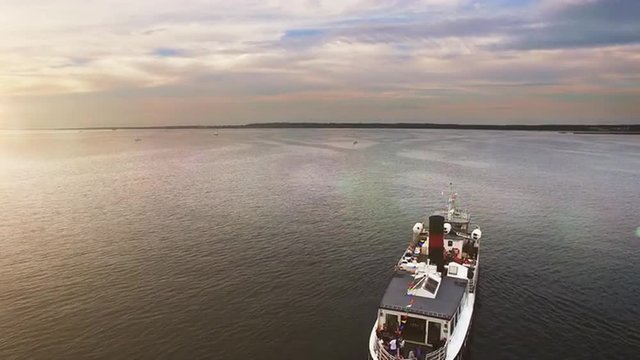 Aerial drone shot of an old vintage cruise ferry in the sea.