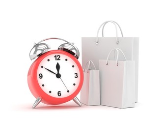 alarm clock and shopping bag (time to buy concept)