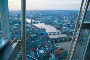 Fototapeta na wymiar City of London panorama at sunset. River Thames, bridges and lit up streets aerial view