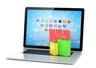 laptop and  shopping pags on white background