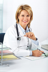 Mature doctor woman in a clinical office.