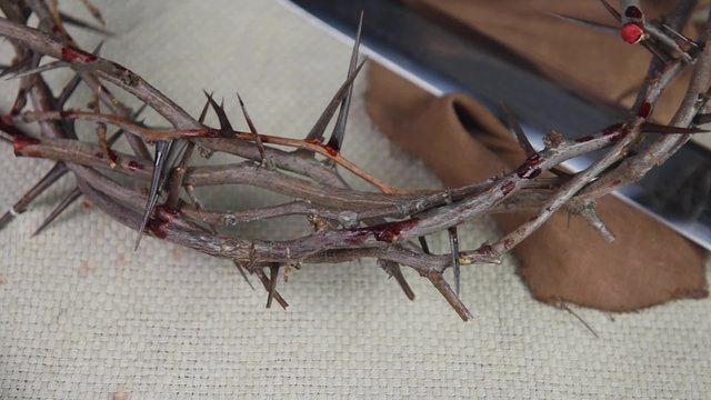 Bible, crown of thorns and Roman sword
