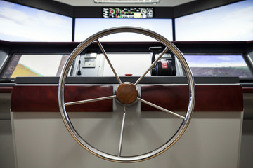 Fototapeta premium Modern ship control panel with steering wheel