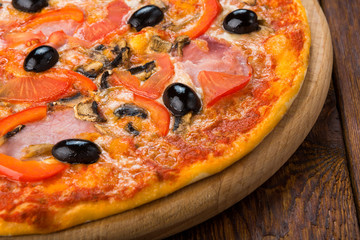 Delicious pizza with salami, mushrooms and olives