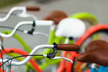 Closeup of bicycle's handlebars and saddles