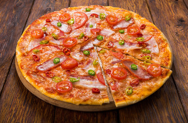Delicious pizza with red and green hot chili peppers
