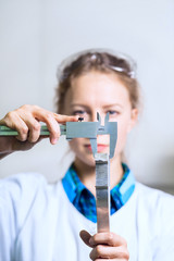 Woman engineer detail measure caliper