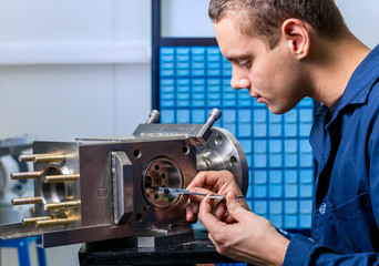 engineer with a caliper measuring device in the modern laboratory