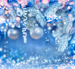 Christmas holiday background. Hanging baubles on Christmas tree