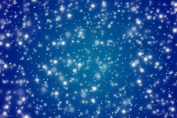 Winter blue background with the falling snow flakes.