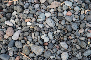 Stones on the beach at Kamari on the Greek island of Santorini