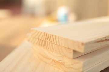 carpenter table with pine wood, paint blue, pink and several brushes
