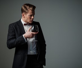 Sharp dressed man wearing jacket and bow tie