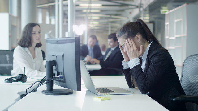 Exhausted and Stressed Female Worker on Workplace in Office. Shot on RED Cinema Camera.