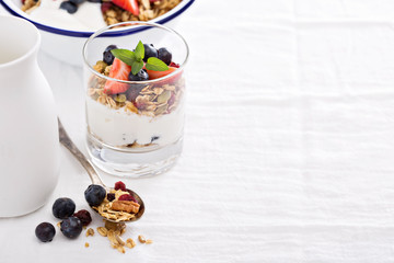 Granola with fresh berries in a blue bowl