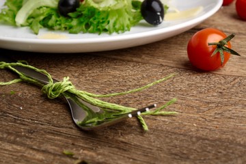 Fresh vegetables salad with tomatoes , olives , parmesan cheese