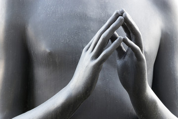 Bronze hands of a statue