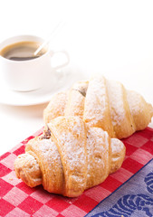 Hot cappuccino and pastries on white wooden boards