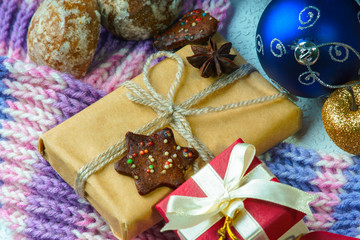 Christmas balls, gift box, winter scarf and cookies