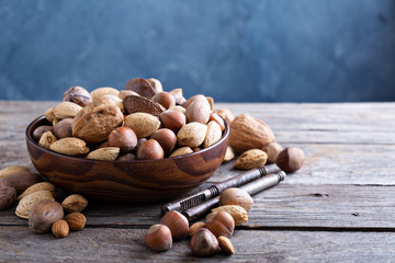 Variety of nuts with shells in a bowl