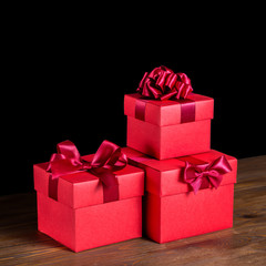 greeting boxes with bow on wooden background is isolated, closeu
