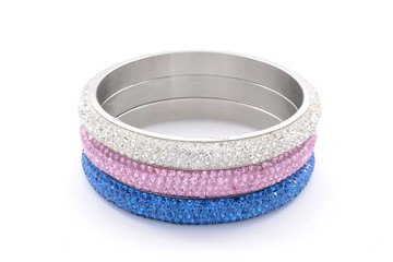 three bracelets on a white background