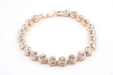 thin gold bracelet on a white background