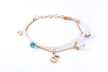 bracelet with pearls and pendants isolated on white