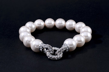 Bracelet of pearls isolated on black