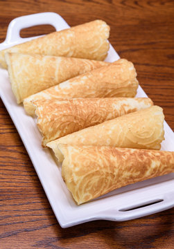 Holiday Krumkake cookies ready to eat on a white serving platter 

