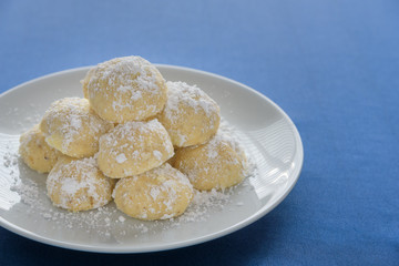Holiday Russian Tea Cake cookies ready to eat on a white serving plate
