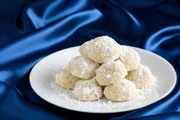 Holiday Russian Tea Cake cookies ready to eat on a white serving plate
