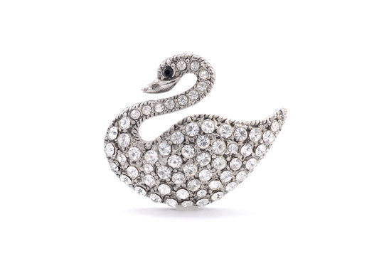 swan brooch on a white background