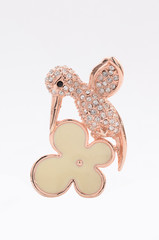 Brooch in the form of a hummingbird on a white background