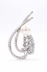 brooch with pearl on a white background