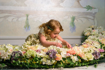 Little girl in dress with flowers