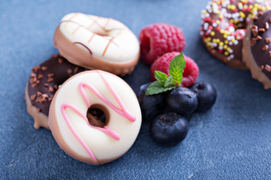Small mini donuts with fresh berries
