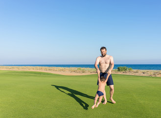 Father and son on beach